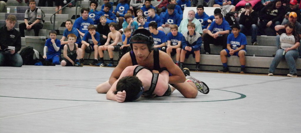 Bobcat Lucas Lopez analyzes his next move during the Georgia Middle School Duals Tournament. Lopez took first place in the 14U, 110-pound weight class at the North Hall Trojan War last Saturday. (Photo by: Kevin Hensley)