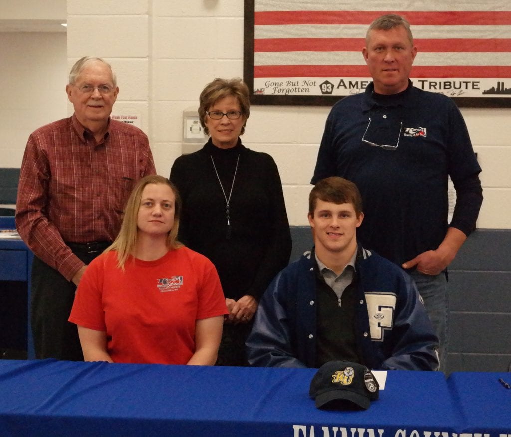Jack Roper is seated with his family (standing, left to right: Maynard, Patricia and Jeff Roper and seated alongside Jack is Joanna Roper. Tyler committed to playing college football for the Reinhardt University Eagles yesterday, during a ceremony at Fannin County High School. (Photo by: Kevin Hensley)