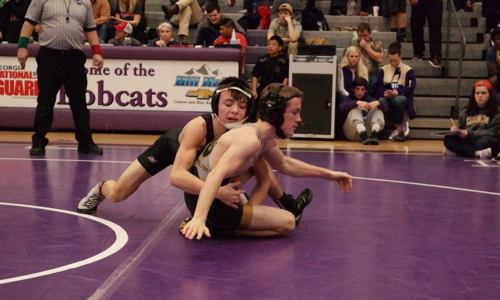 Dragon Koby Milner maintains control over his opponent at the AAAA Sectionals at Gilmer High School last Saturday. Milner won the 106-pound weight class at the tournament and will join three other Pickens grapplers at the state traditional tournament this week. (Photo by: Kevin Hensley)