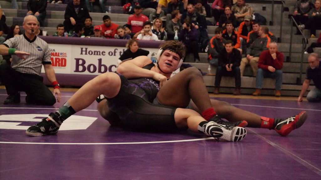 Bobcat Matthew Waddell is seconds away from pinning his adversary at the AAAA Sectionals last Saturday at Gilmer High School. Waddell enters the state traditional tournament this week with an overall record of 29-1 and will join 11 other Bobcats at the tournament. (Photo by: Kevin Hensley)
