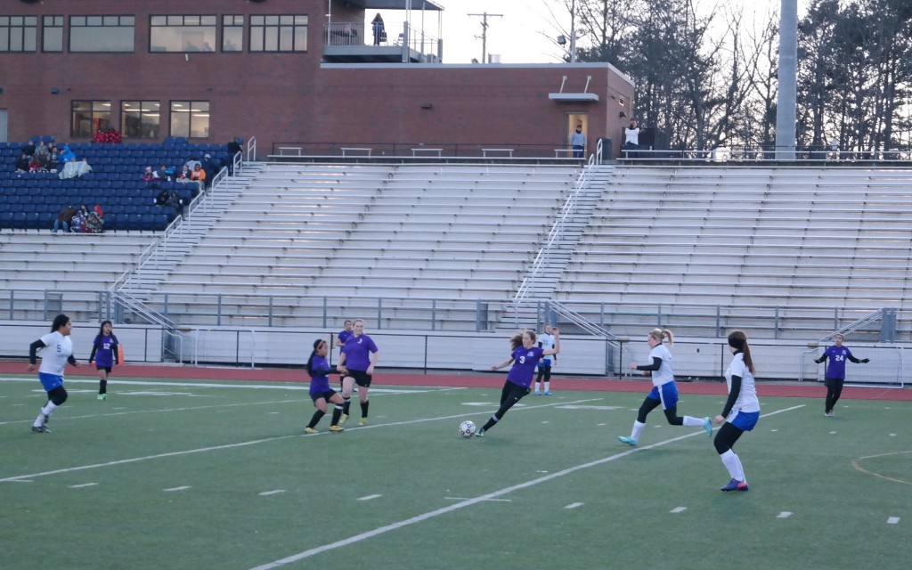 Lady Cat Josie Sheahan looks to free the ball from heavy Lady Rebels pressure last Friday. Against Murray County one day prior, she scored the fifth and final goal in a 5-0 Gilmer victory over the Lady Indians. (Photo by: Kevin Hensley).