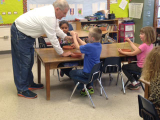 1st Grade Birds: Mrs. Herndon’s class: Melton Callahan, Dawson Hawkins (blue shirt), Brooklynn Siler, Yarley Vargas-Garcia. Education Committee member Melton Callahan lends a helping hand with bird feeder wires.
