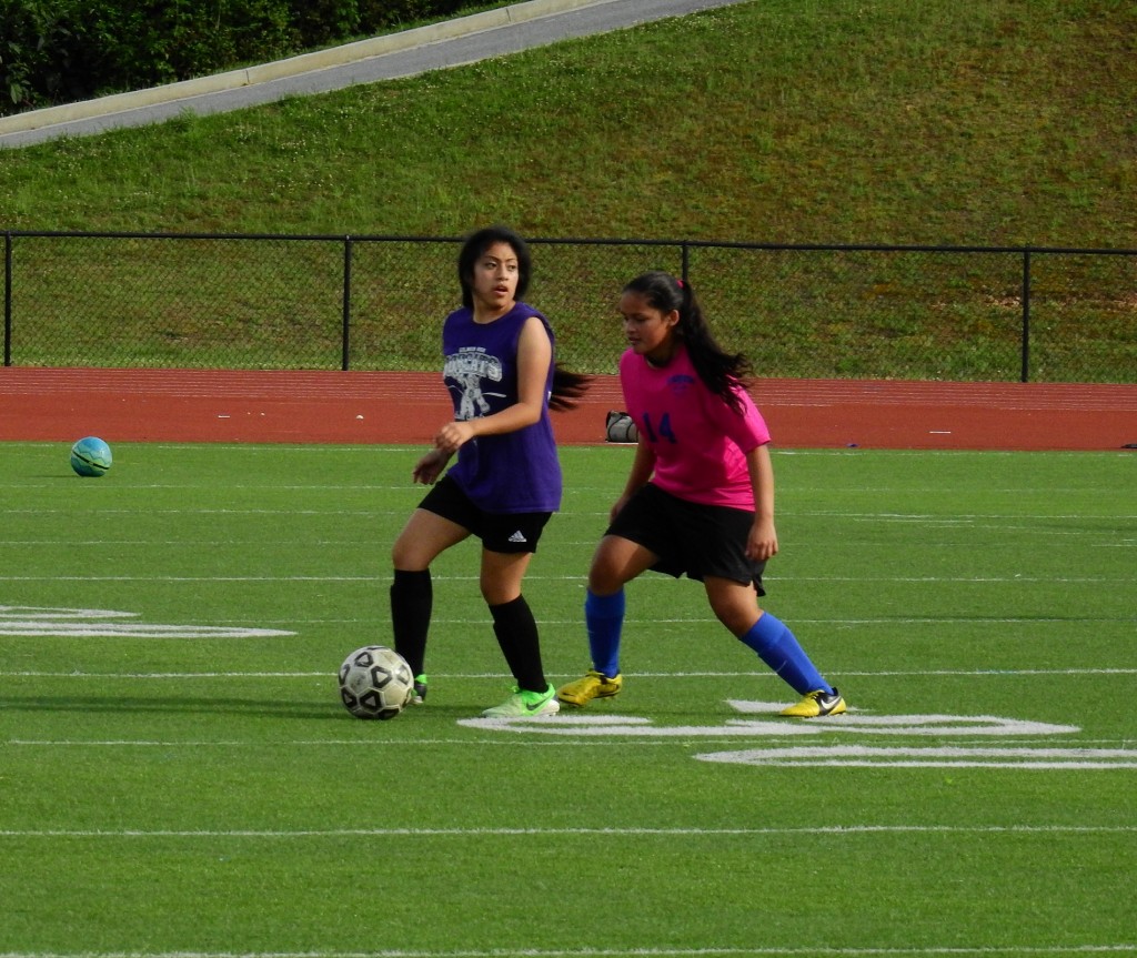 Lady Cat Elsa Francisco looks upfield for an open player, during a friendly match against Fannin Monday. Francisco scored a match-tying goal late in the second half, but the Lady Rebels responded less than a minute later to take an eventual match-winning 3-2 victory. (Photo by: Kevin Hensley)