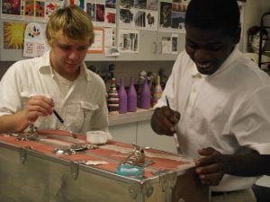 G.I.V.E. East students paint the trunk destined for FCMS. Picture courtesy of Georgia Commission on the Holocaust.