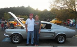 Anthony Holloway with his wife, 4th grade teacher Katy Holloway, in front of his '67 Ford Mustang