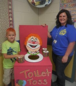 Colby and Special Ed teacher Jenna Saxon are ready for the toilet toss.