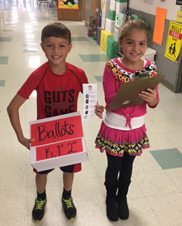4th grade students collecting ballots for the WFES mock election. Matthew Ponton and Brayden Whitener