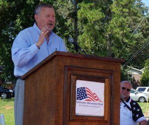 John Trammell, President and CEO of Community Bank of Pickens County, offers his words at the dedication of Pickens' Veterans Memorial Park.
