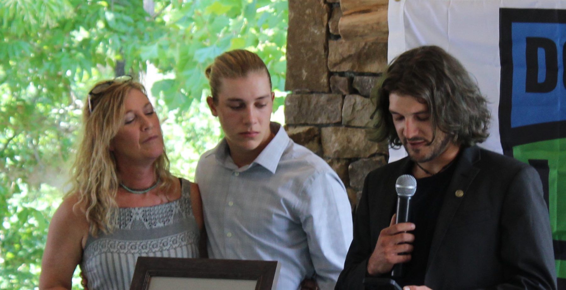 Sydnie's mother and brothers at the dedication.